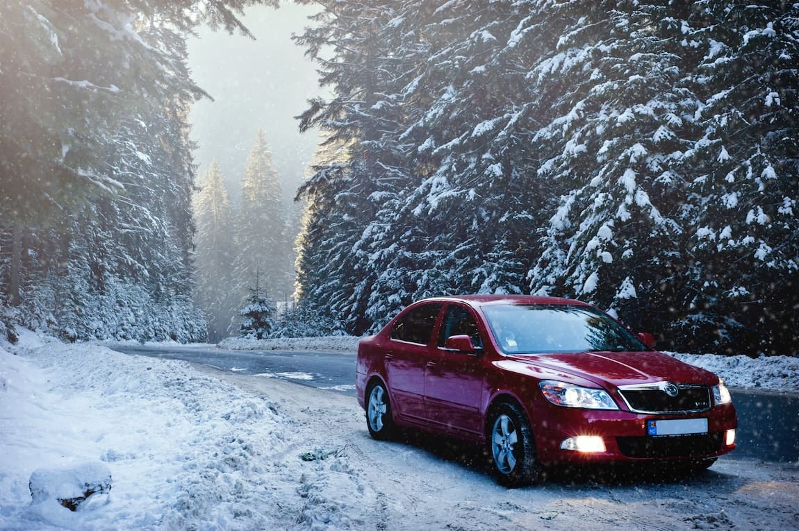 Skoda on Snowy Road in FOrest