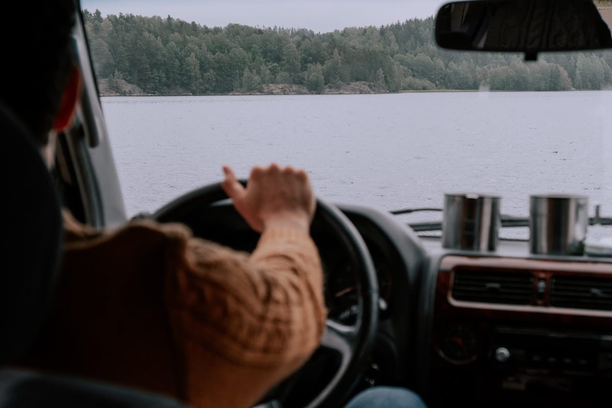 Driving a car with cups on the dashboard