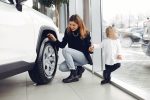 Lady inspecting Alloy Wheel