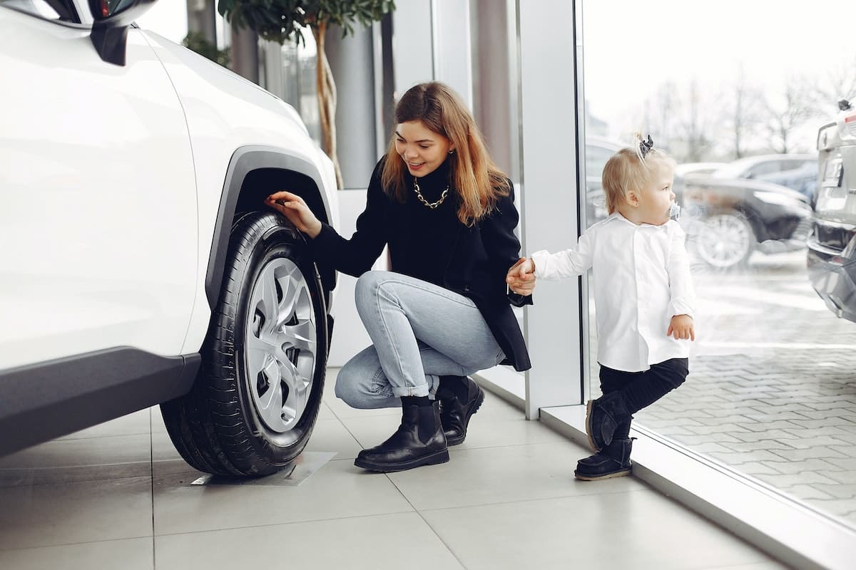 Lady inspecting Alloy Wheel
