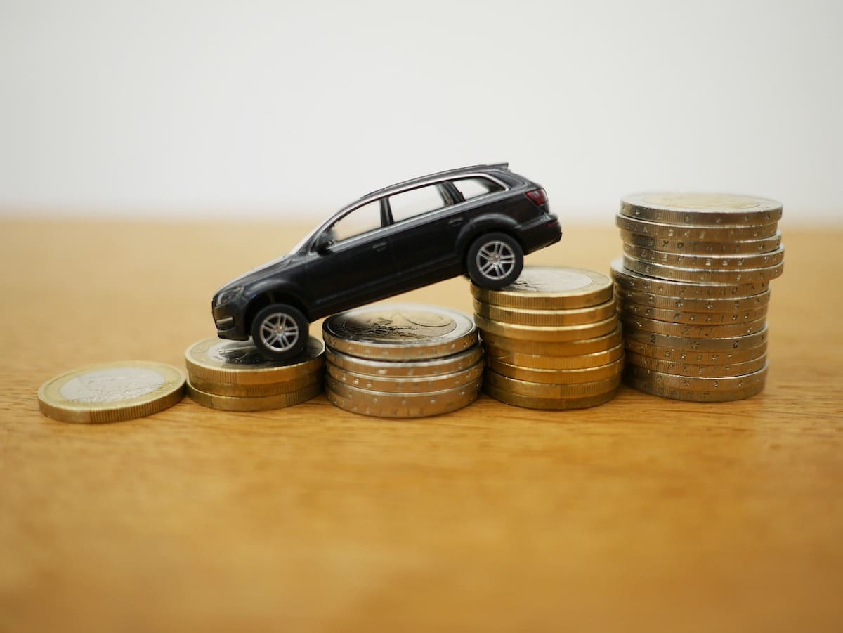Car going downhill on money