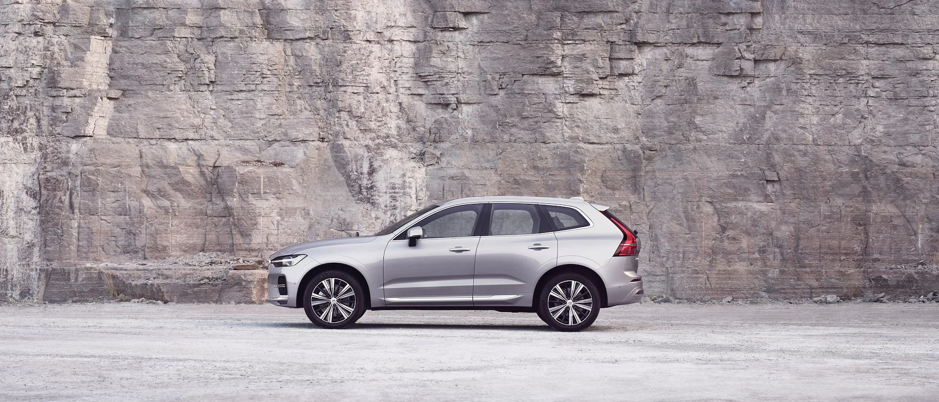 Volvo XC60 in Silver against a stone brick wall