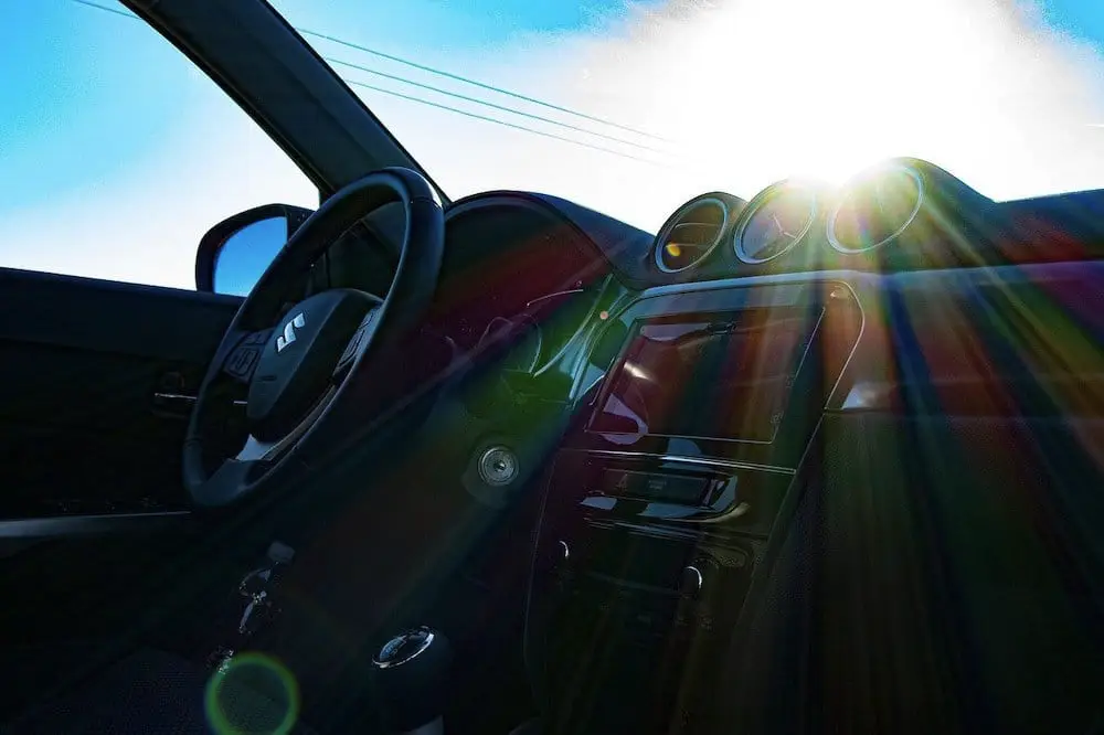 Car Dashboard with sun shining through windscreen