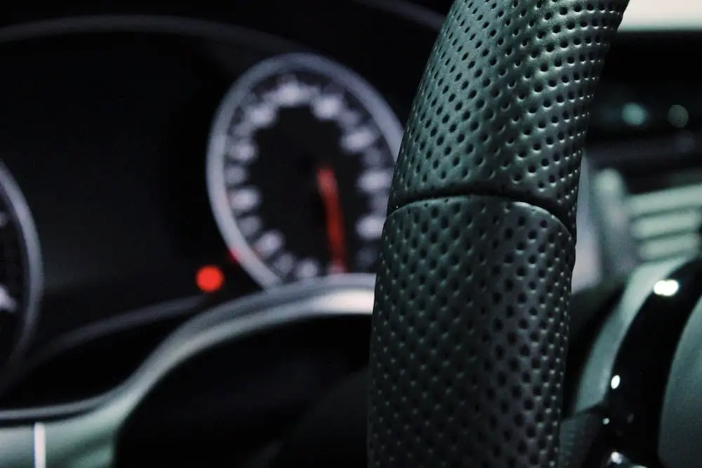 Speedo out of focus with steering wheel in foreground