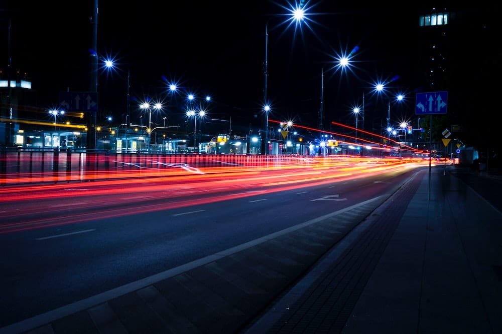 Ligt streams at night from car headlights