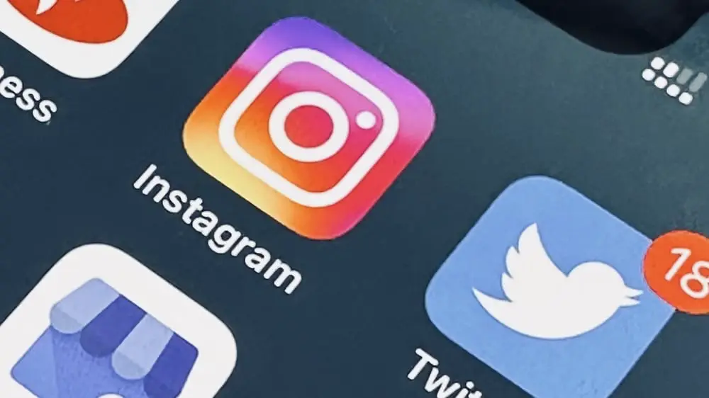 Photo of an iPhone screen showing the Instagram and Twitter app logos